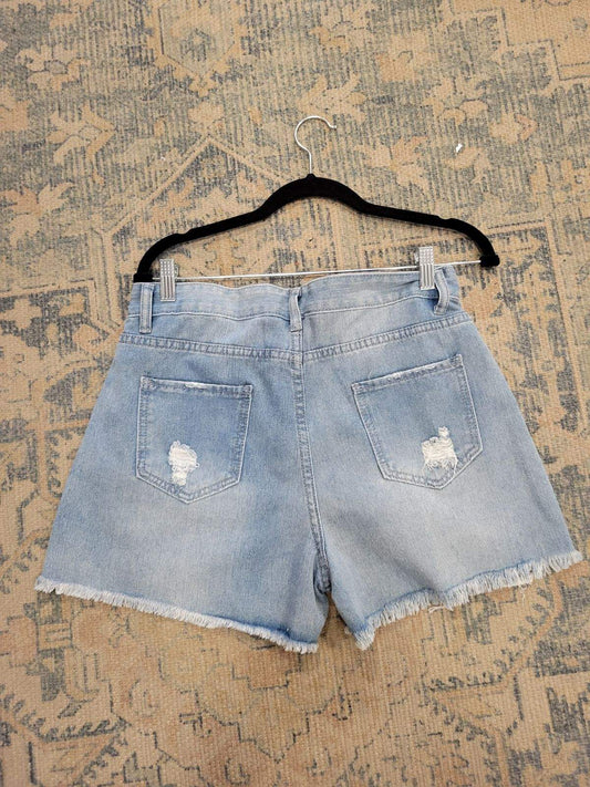 High-waisted denim shorts with frayed edges